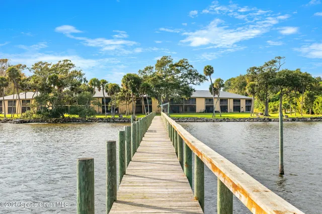 a view of a swimming pool with an outdoor space and seating area