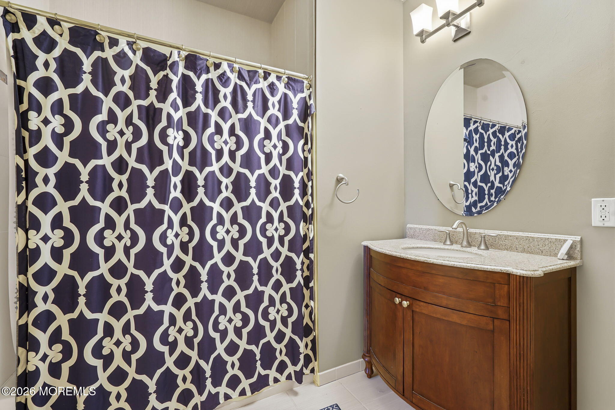 106 Potts Road Morganville, NJ 07751 - Photo 18 of 25 a bathroom with a sink and a mirror