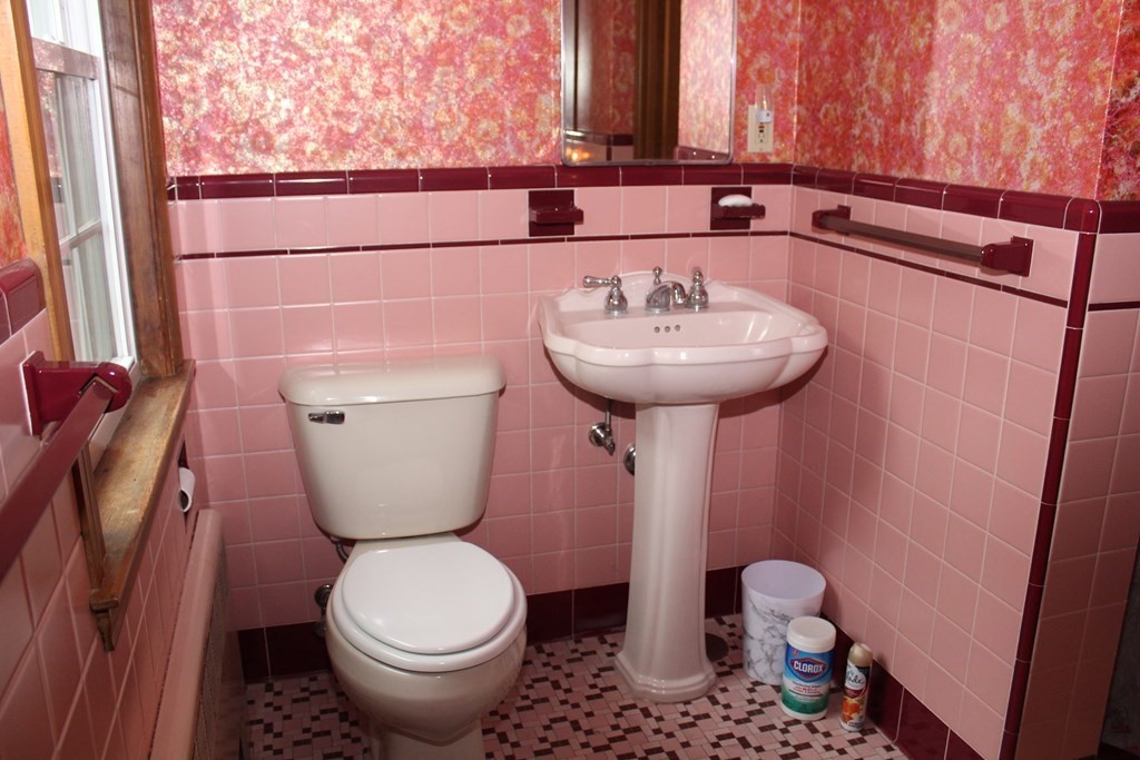 128 Webster Street Needham, MA 02494 - Photo 14 of 16 a bathroom with a toilet sink and mirror