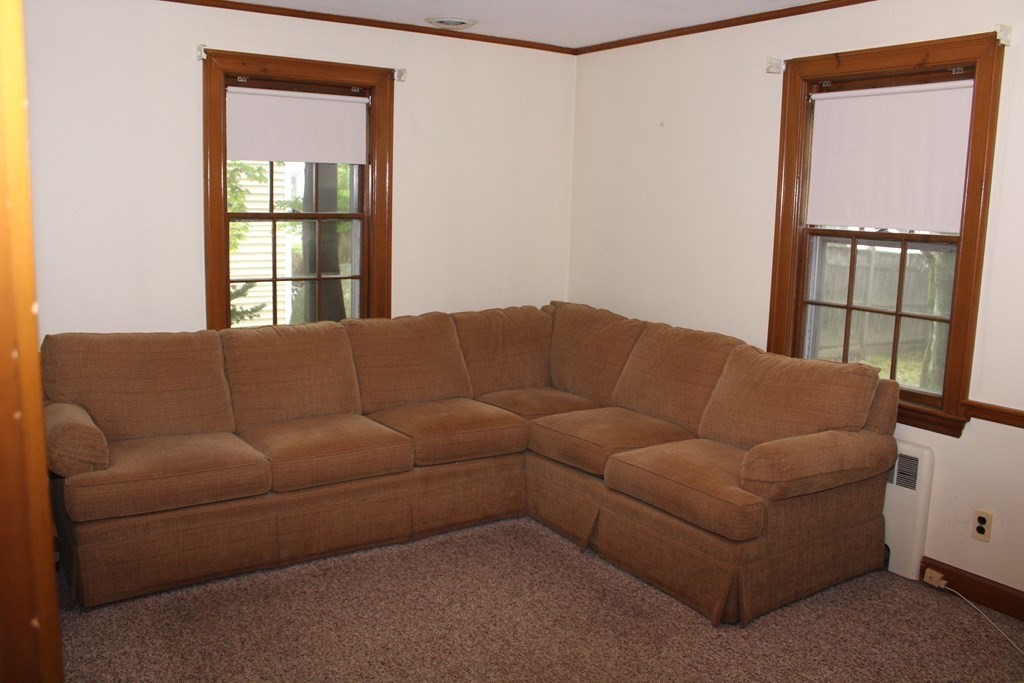 128 Webster Street Needham, MA 02494 - Photo 8 of 16 a living room with furniture and a window