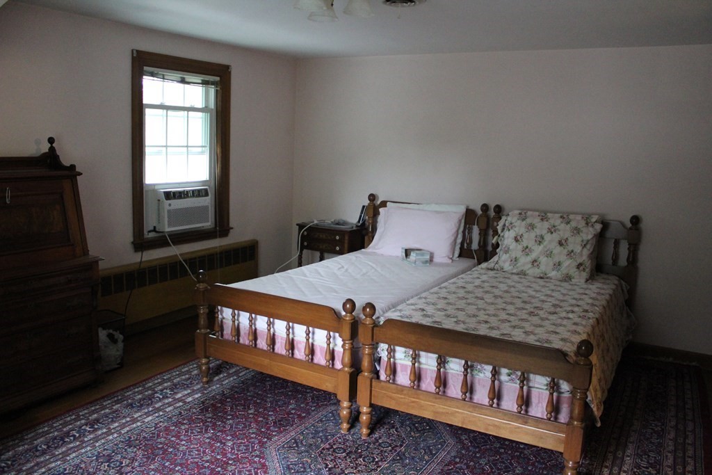 128 Webster Street Needham, MA 02494 - Photo 10 of 16 a bedroom with a bed next to a window