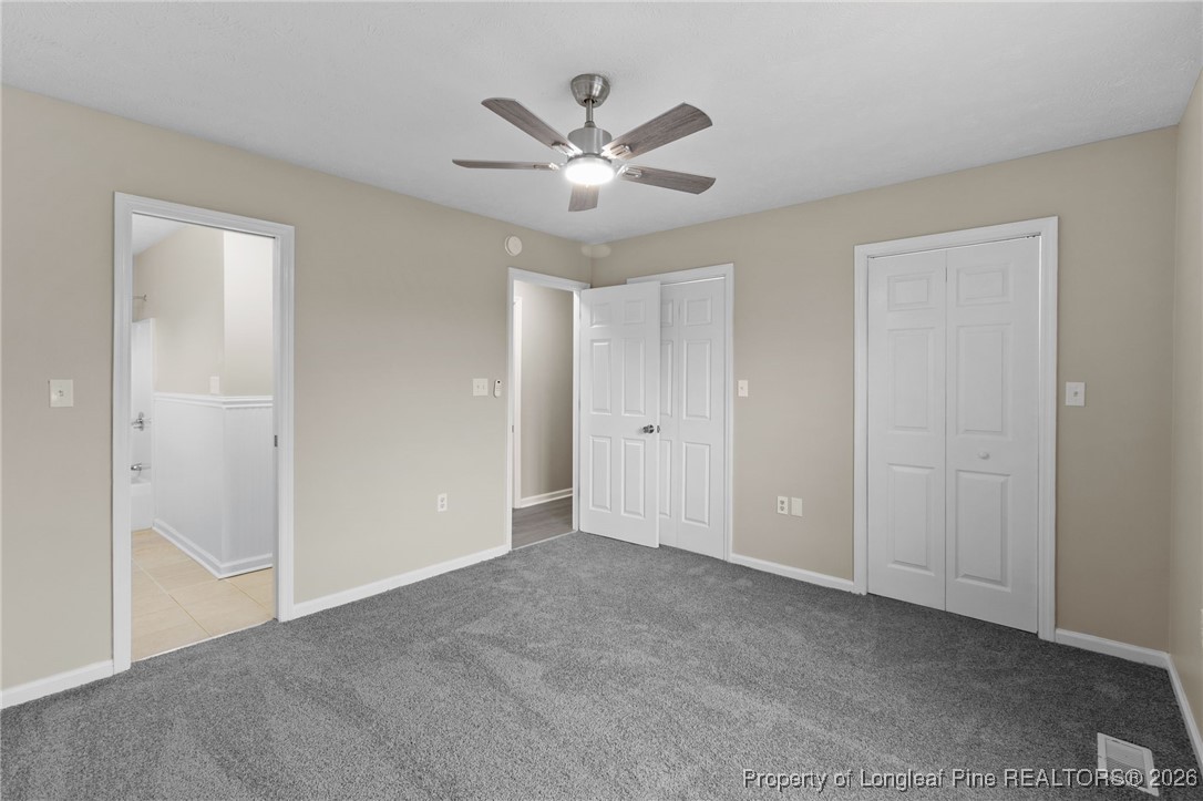 122 Spring Valley Drive Raeford, NC 28376 - Photo 17 of 36 a view of an empty room with a ceiling fan