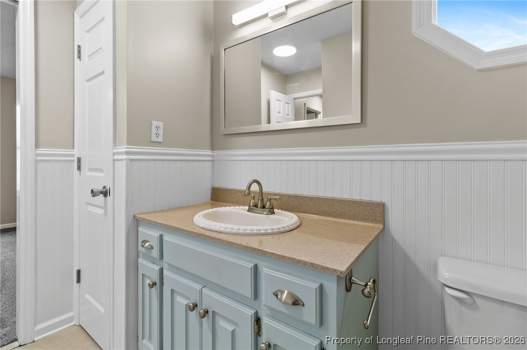 122 Spring Valley Drive Raeford, NC 28376 - Photo 20 of 36 a bathroom with a sink and a toilet
