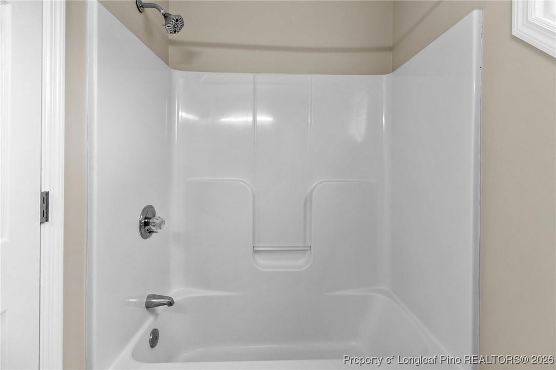 122 Spring Valley Drive Raeford, NC 28376 - Photo 26 of 36 a bathroom with a bathtub