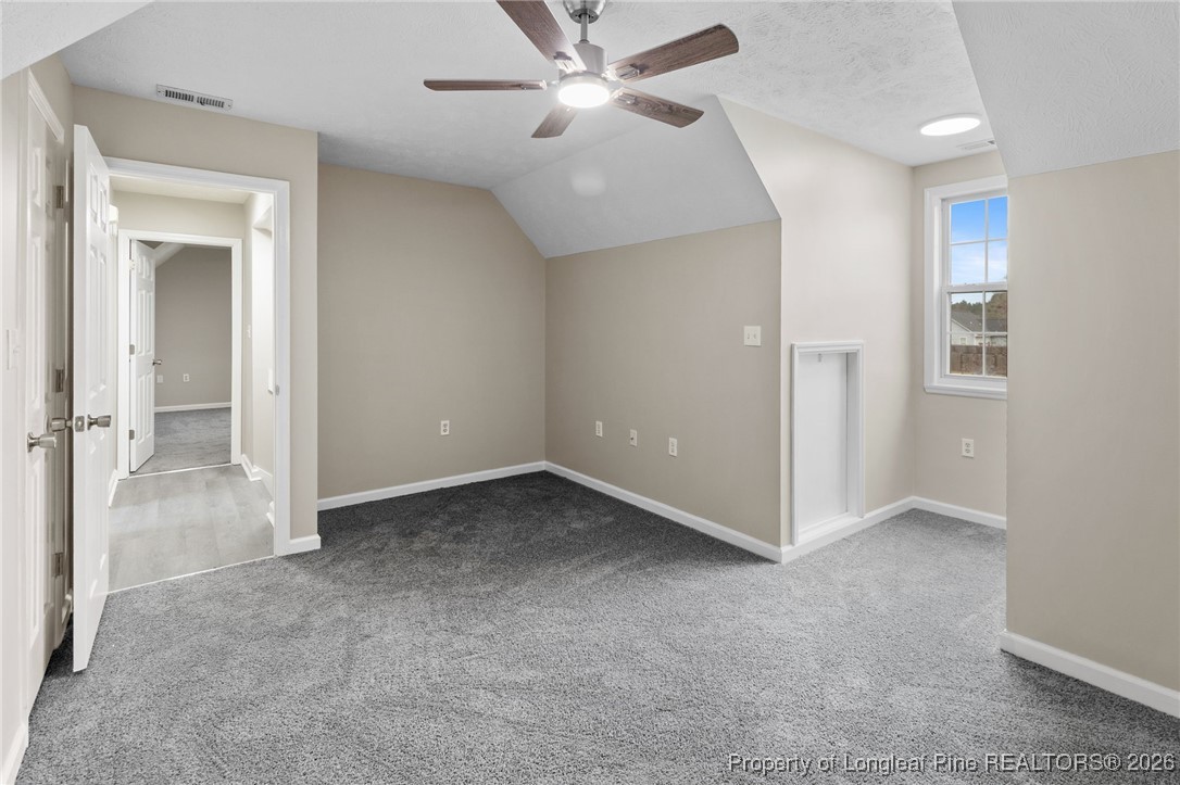 122 Spring Valley Drive Raeford, NC 28376 - Photo 28 of 36 an empty room with closet and a ceiling fan