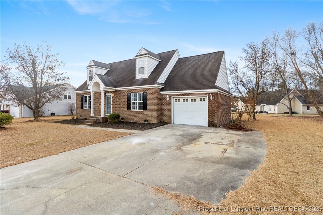 122 Spring Valley Drive Raeford, NC 28376 - Photo 4 of 36 a view of a white house with a yard covered in snow