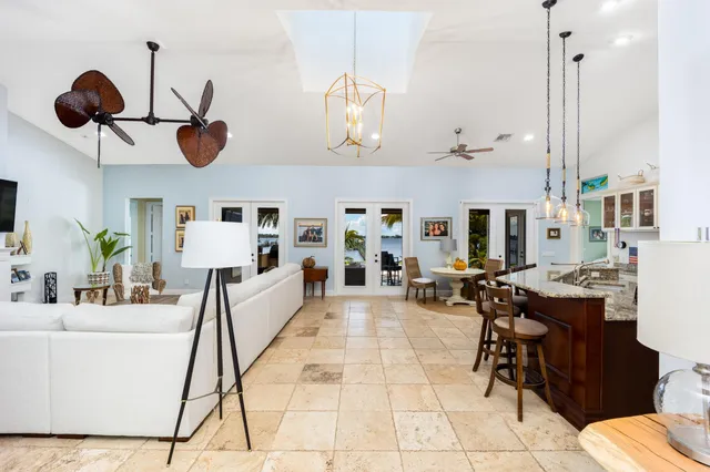 a kitchen with stainless steel appliances granite countertop a stove sink and cabinets