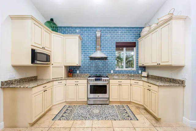 a spacious bathroom with a granite countertop sink a mirror and a shower
