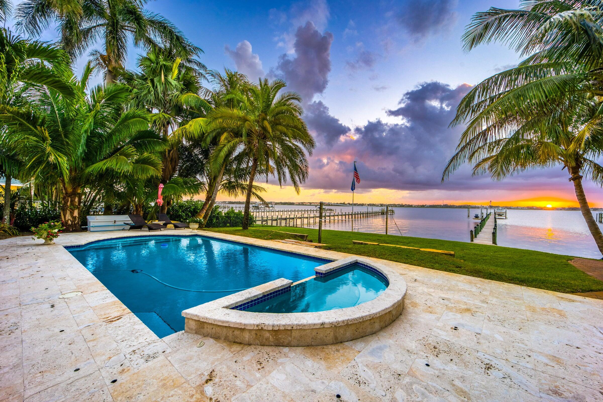 2672 Northwest S Shore Road Stuart, FL 34994 - Photo 3 of 53 a view of a swimming pool with a yard