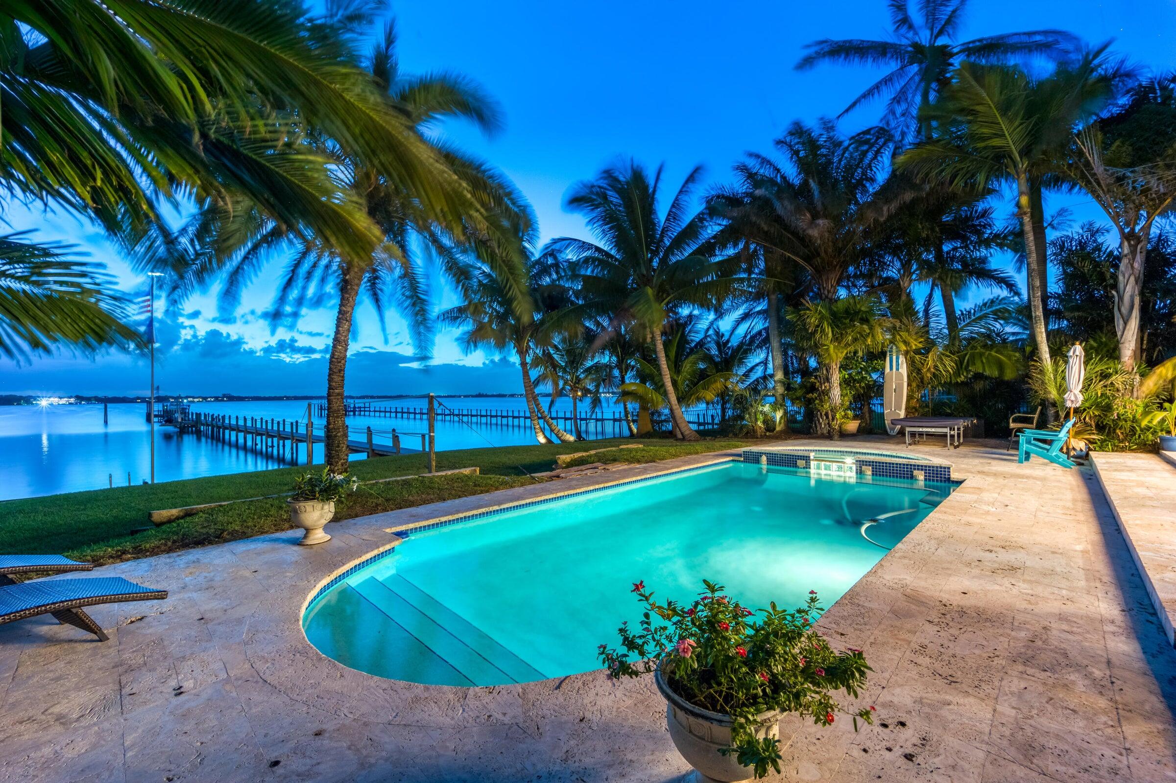 2672 Northwest S Shore Road Stuart, FL 34994 - Photo 5 of 53 a view of a swimming pool with a garden