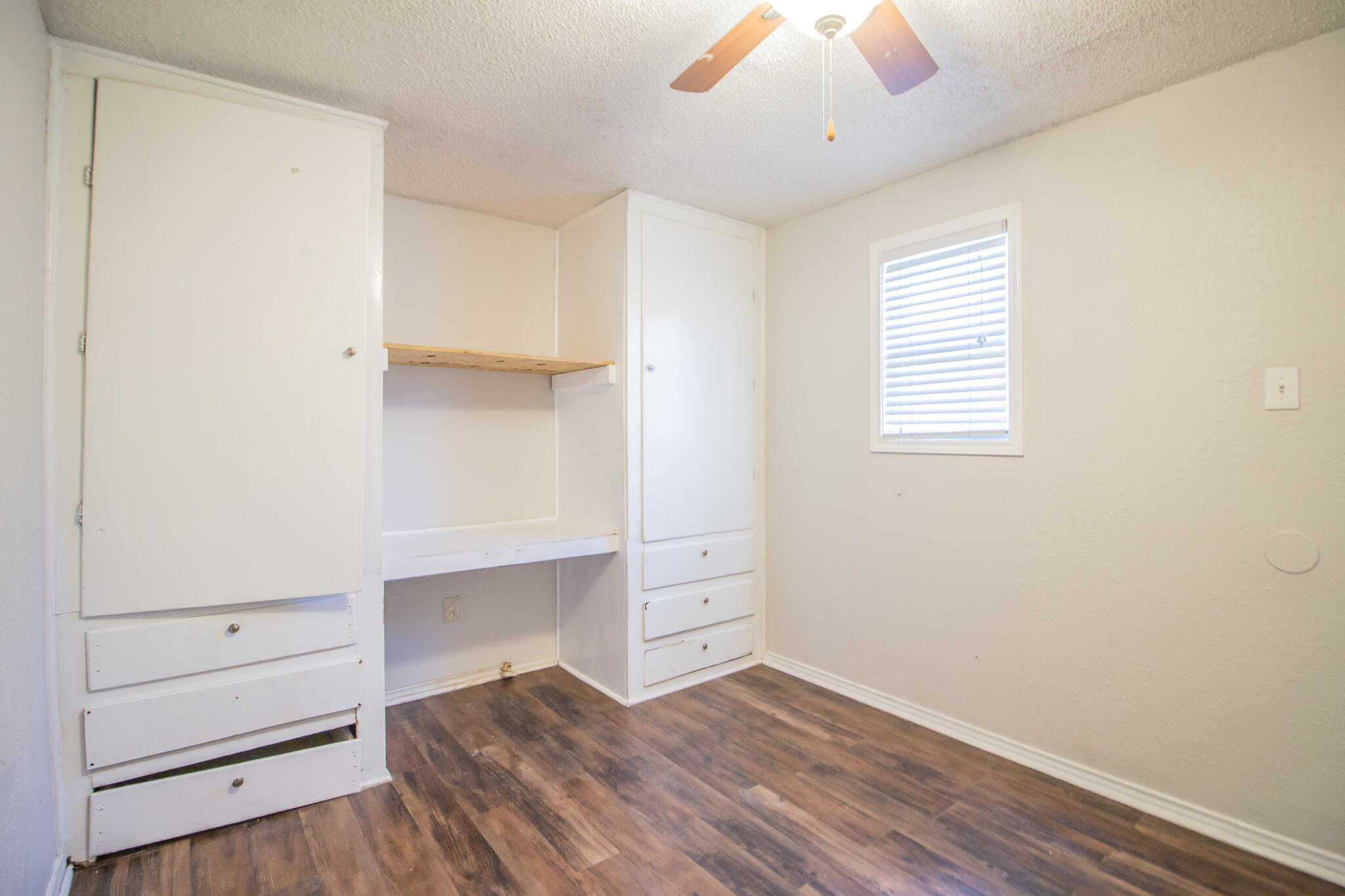 3721 31st Street Lubbock, TX 79410 - Photo 11 of 21 a view of room with window and wooden floor