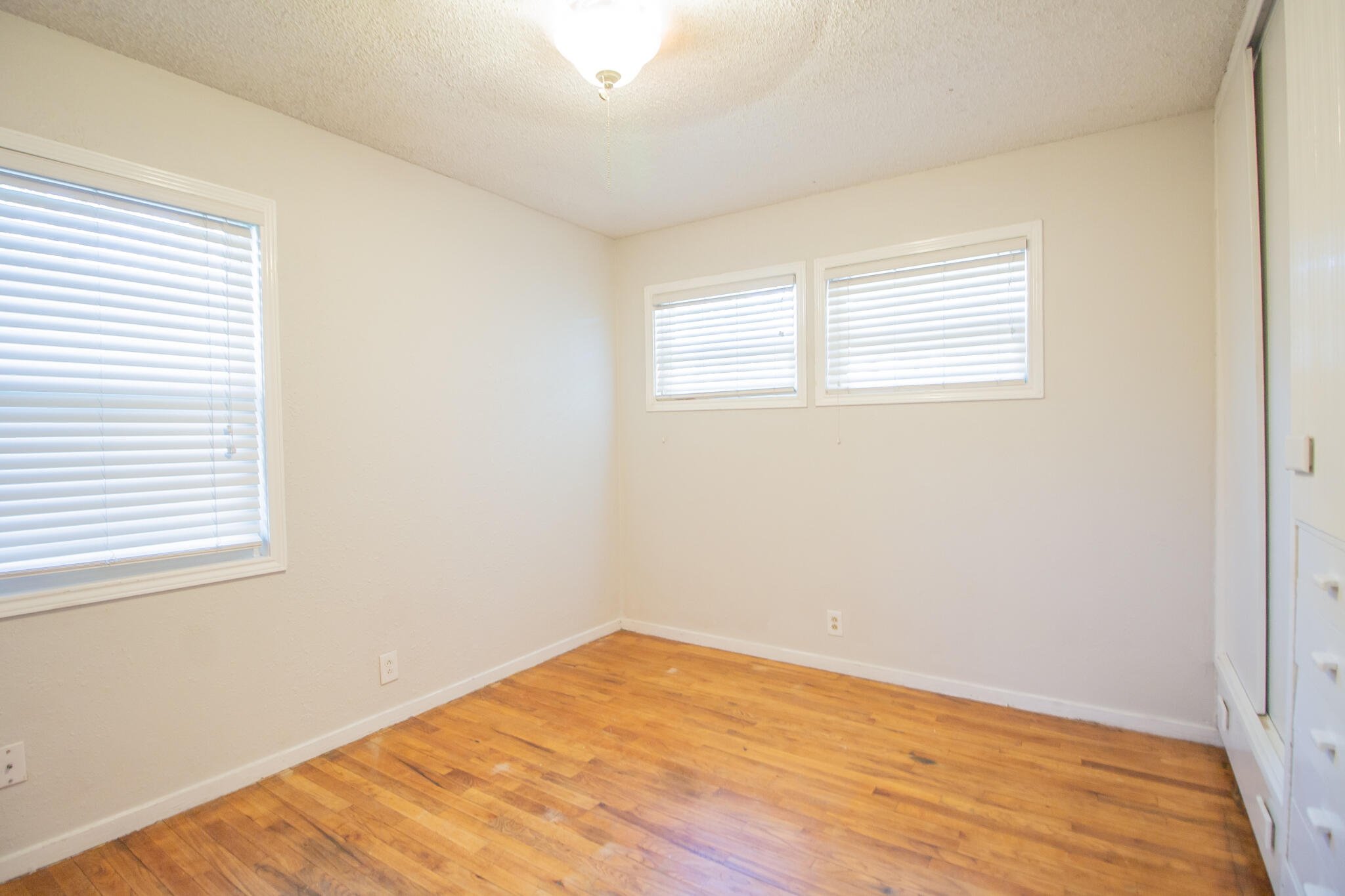 3721 31st Street Lubbock, TX 79410 - Photo 12 of 21 a view of empty room with wooden floor
