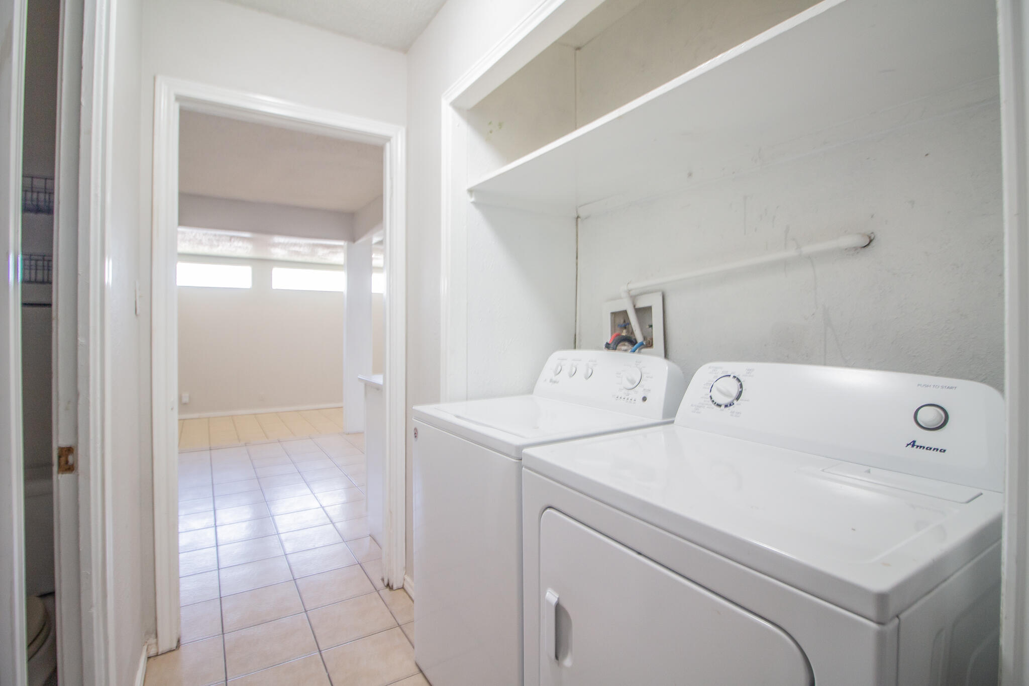 3721 31st Street Lubbock, TX 79410 - Photo 13 of 21 a utility room with dryer and washer