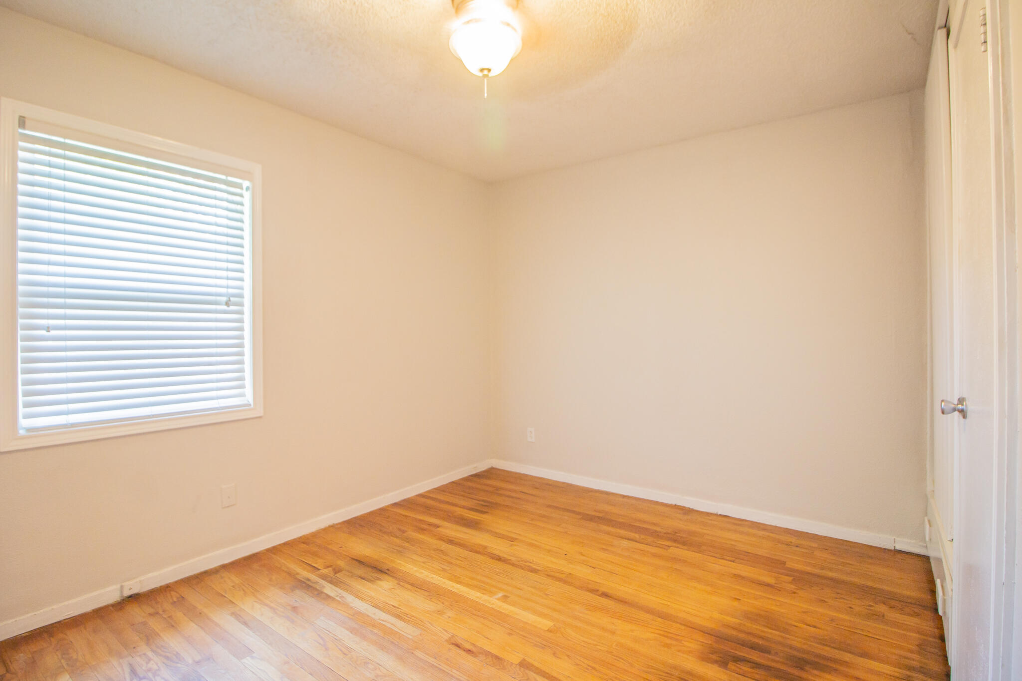 3721 31st Street Lubbock, TX 79410 - Photo 15 of 21 a view of empty room with wooden floor