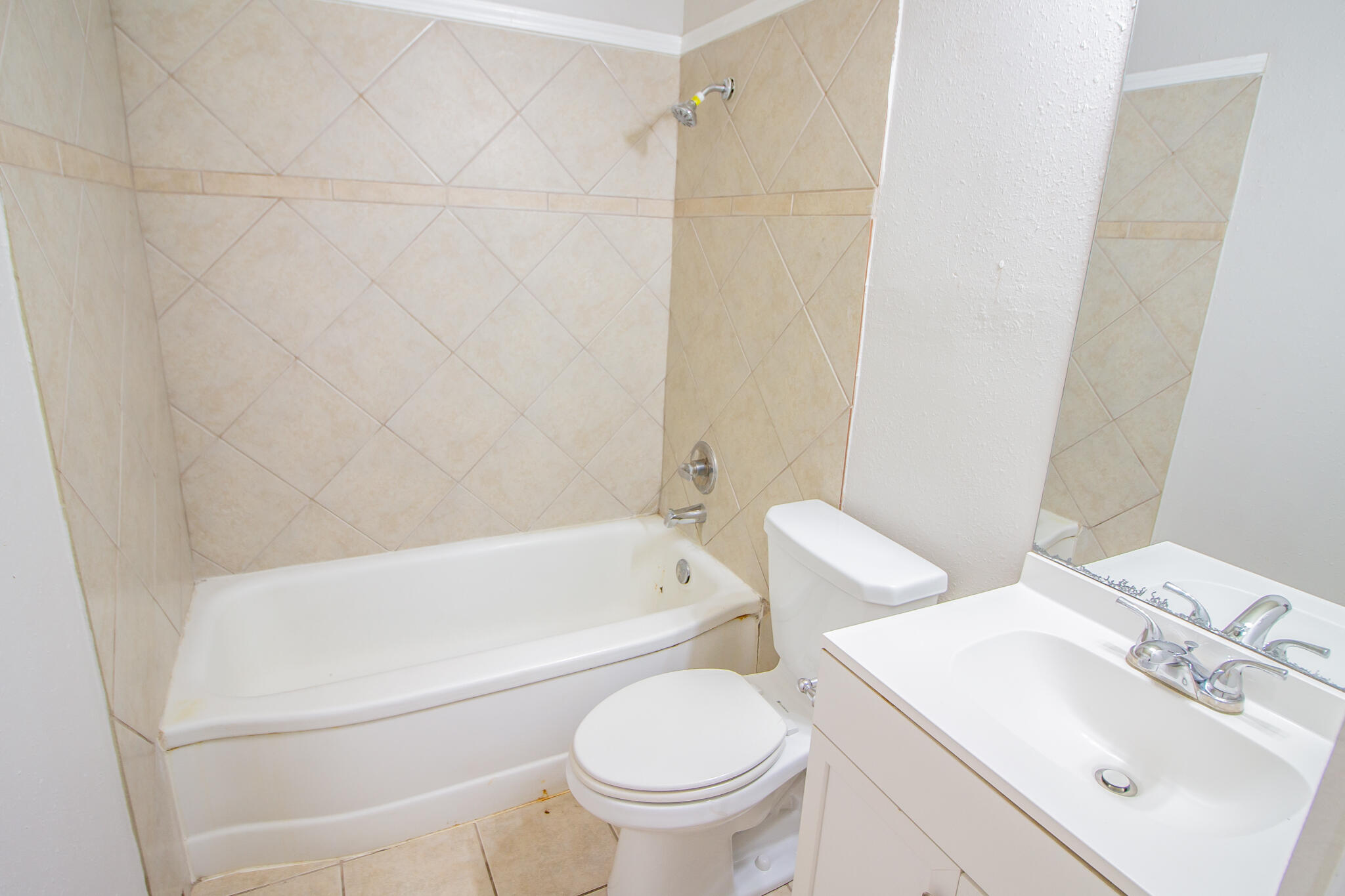 3721 31st Street Lubbock, TX 79410 - Photo 17 of 21 a bathroom with a toilet and a sink