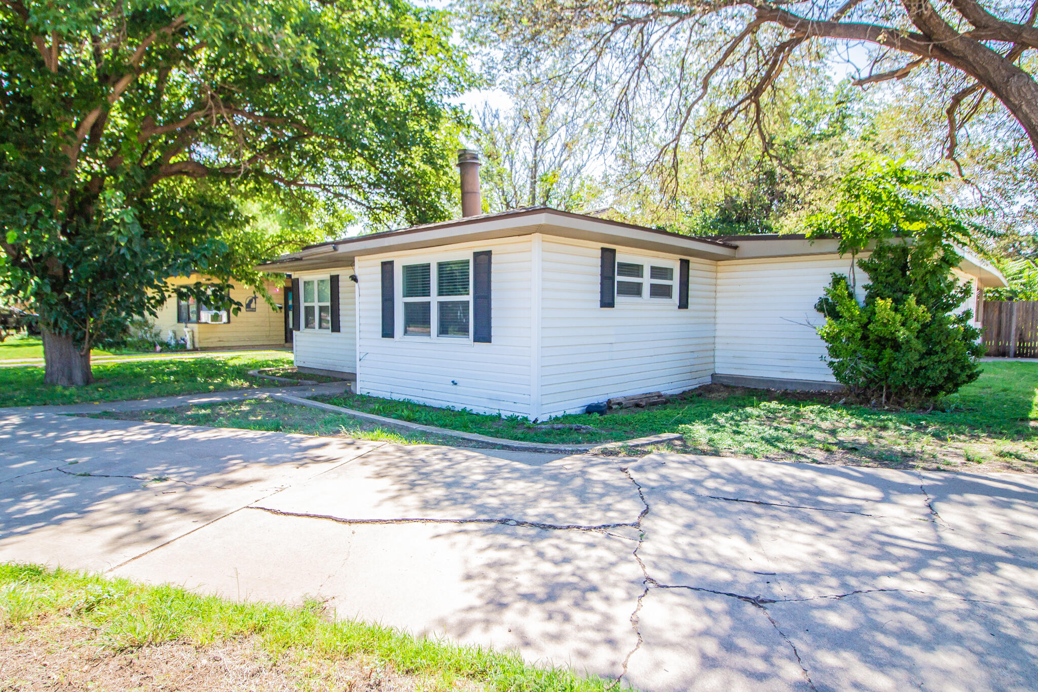 3721 31st Street Lubbock, TX 79410 - Photo 2 of 21 a front view of a house with a garden
