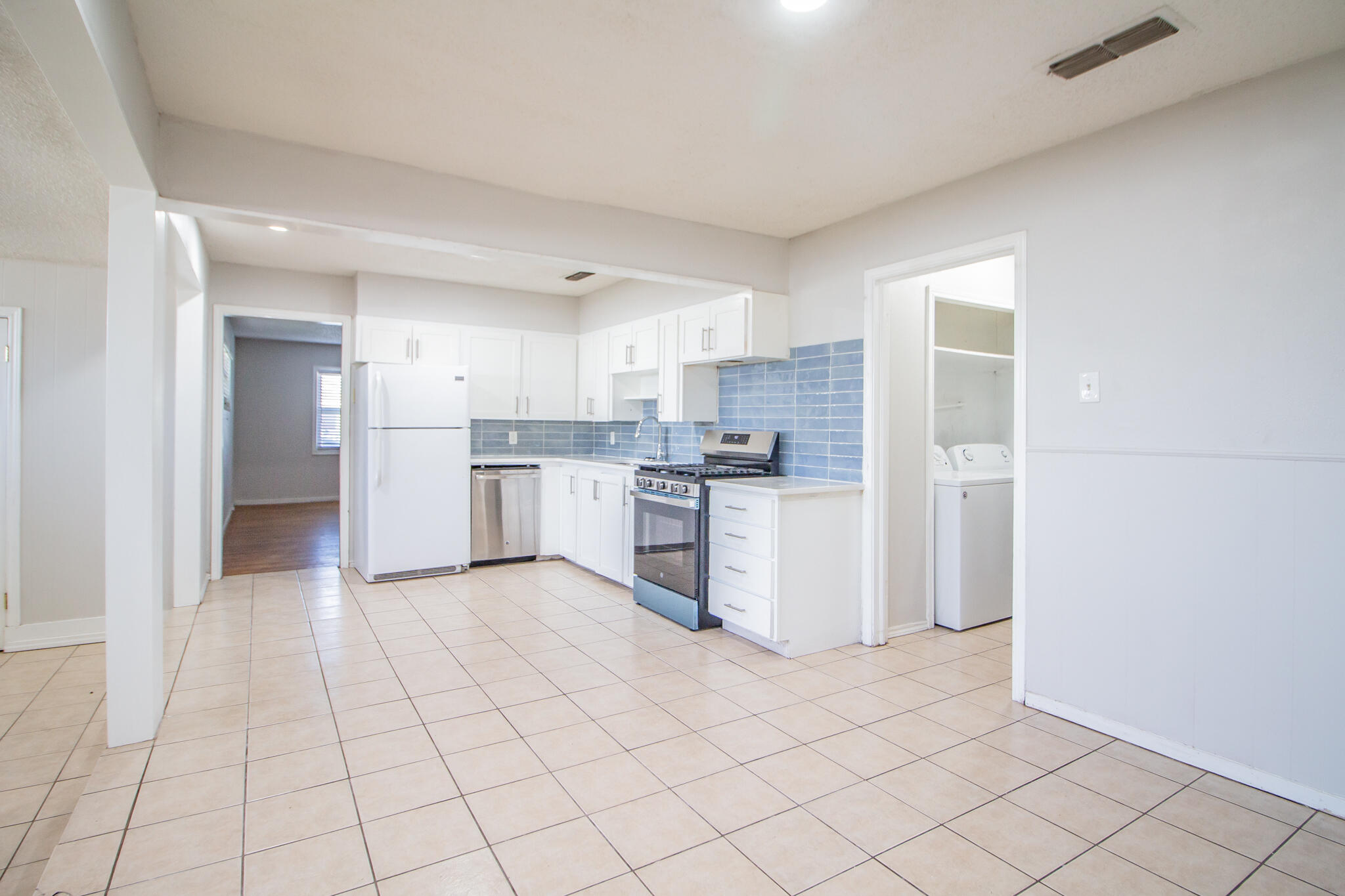 3721 31st Street Lubbock, TX 79410 - Photo 6 of 21 a view of kitchen with white cabinets