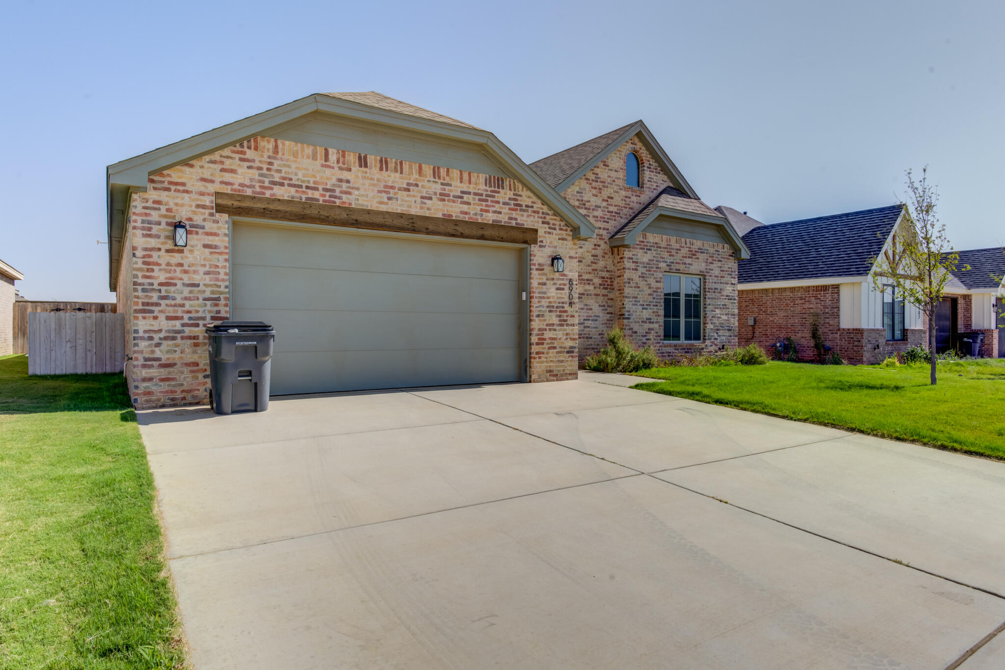 6904 55th Street Lubbock, TX 79407 - Photo 2 of 47 a view of a house with a yard