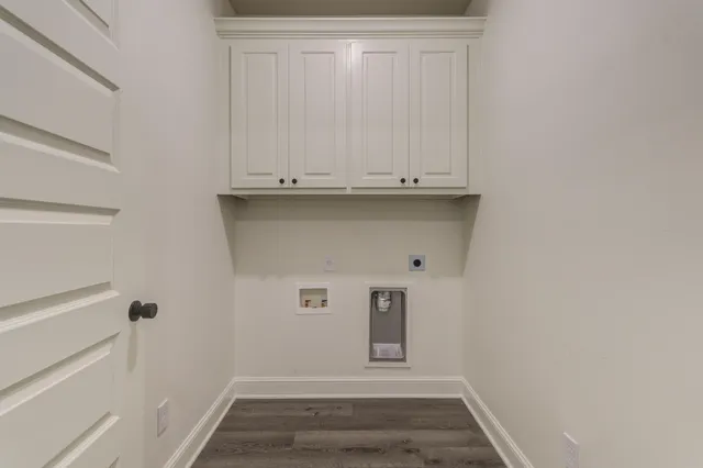 a bathroom with a granite countertop sink and a toilet