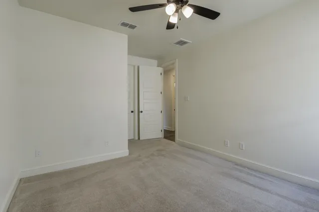 a view of cabinets and wooden floor