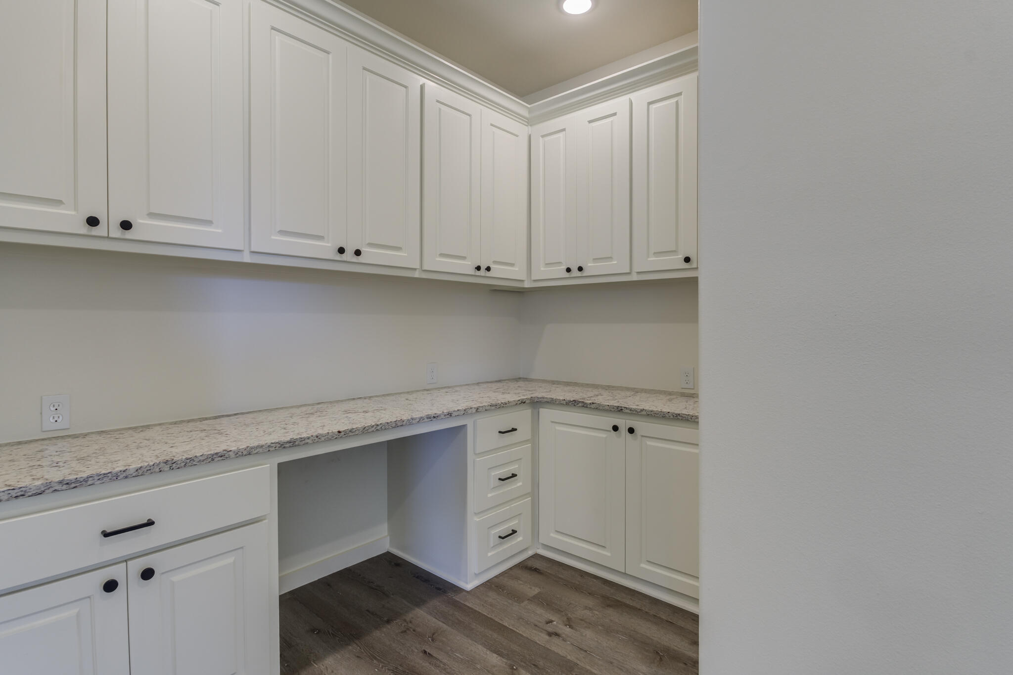 6904 55th Street Lubbock, TX 79407 - Photo 44 of 47 a view of cabinets and wooden floor