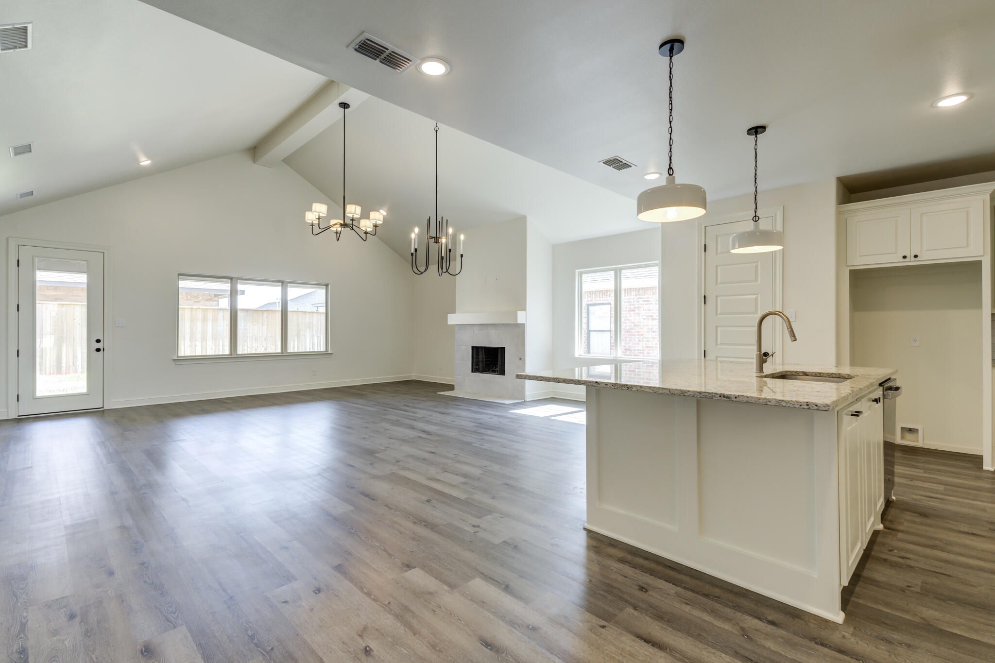 6904 55th Street Lubbock, TX 79407 - Photo 7 of 47 a large kitchen with sink and window