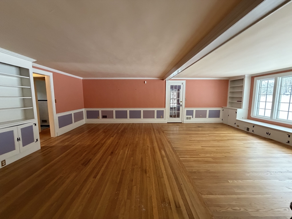 31 Fells Road Winchester, MA 01890 - Photo 11 of 22 a view of an empty room with wooden floor and a window