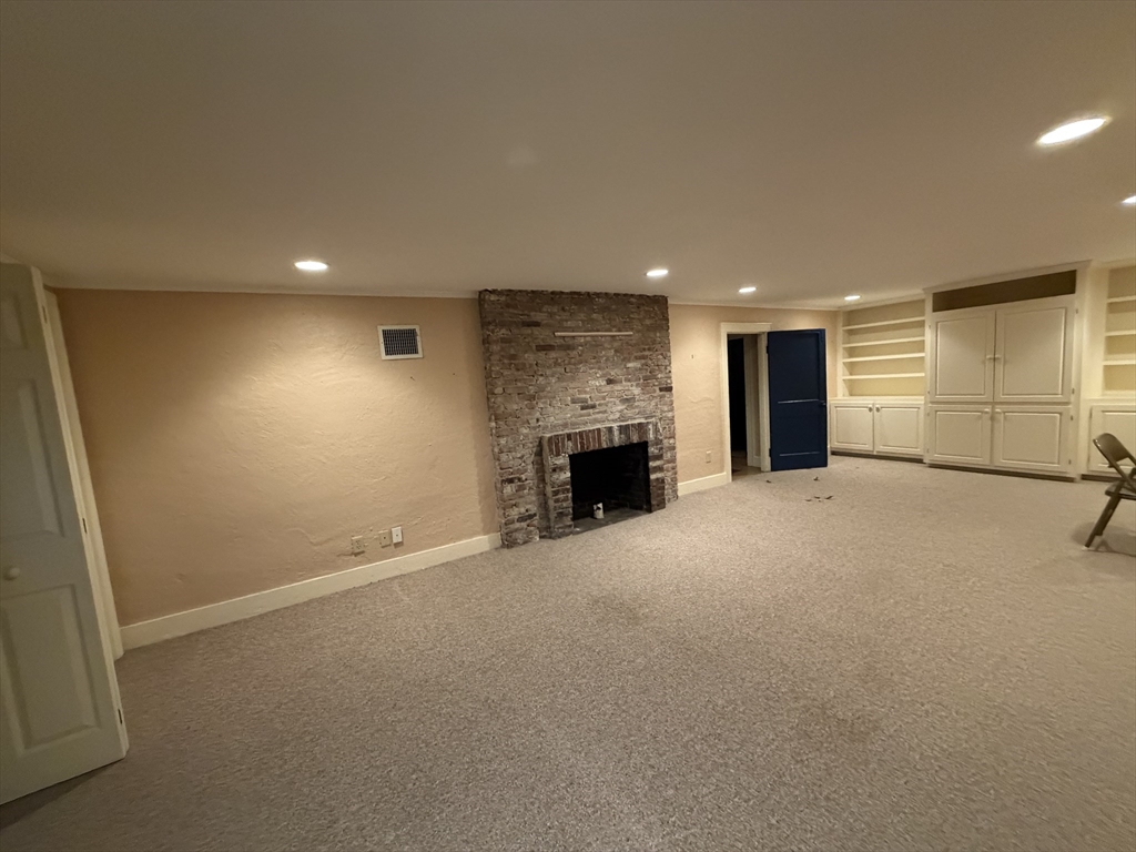 31 Fells Road Winchester, MA 01890 - Photo 13 of 22 a view of an empty room with a fireplace