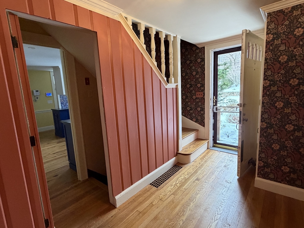 31 Fells Road Winchester, MA 01890 - Photo 16 of 22 a view of a hallway with wooden floor and stairs