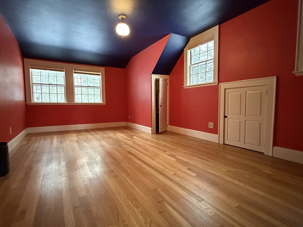 31 Fells Road Winchester, MA 01890 - Photo 17 of 22 an empty room with wooden floor and windows