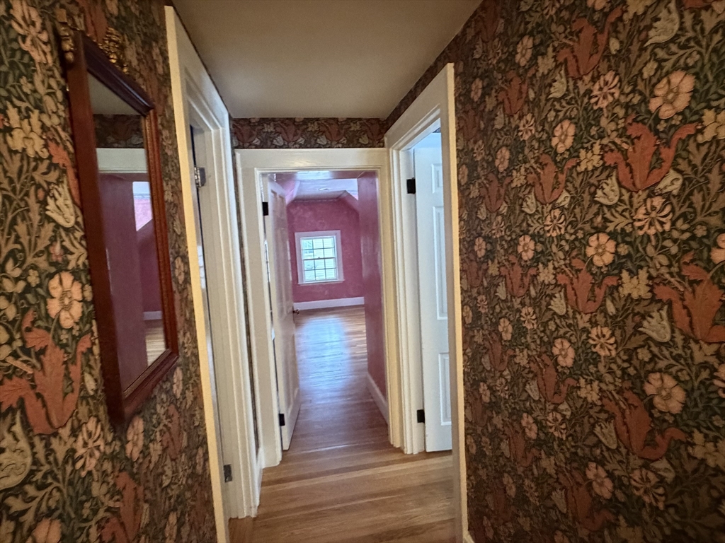 31 Fells Road Winchester, MA 01890 - Photo 18 of 22 a view of a hallway with wooden floor and a door