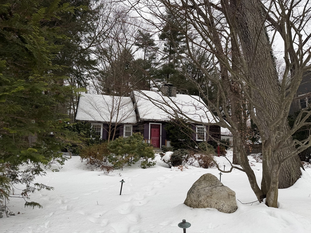 31 Fells Road Winchester, MA 01890 - Photo 2 of 22 a view of a white house covered with snow in the backyard