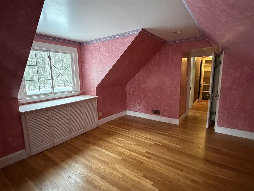 31 Fells Road Winchester, MA 01890 - Photo 22 of 22 a view of an empty room with wooden floor and a window