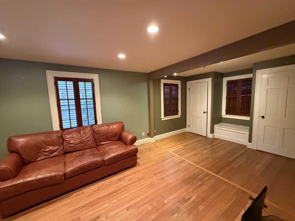 31 Fells Road Winchester, MA 01890 - Photo 3 of 22 a blue bed sitting in a spacious bedroom next to a window