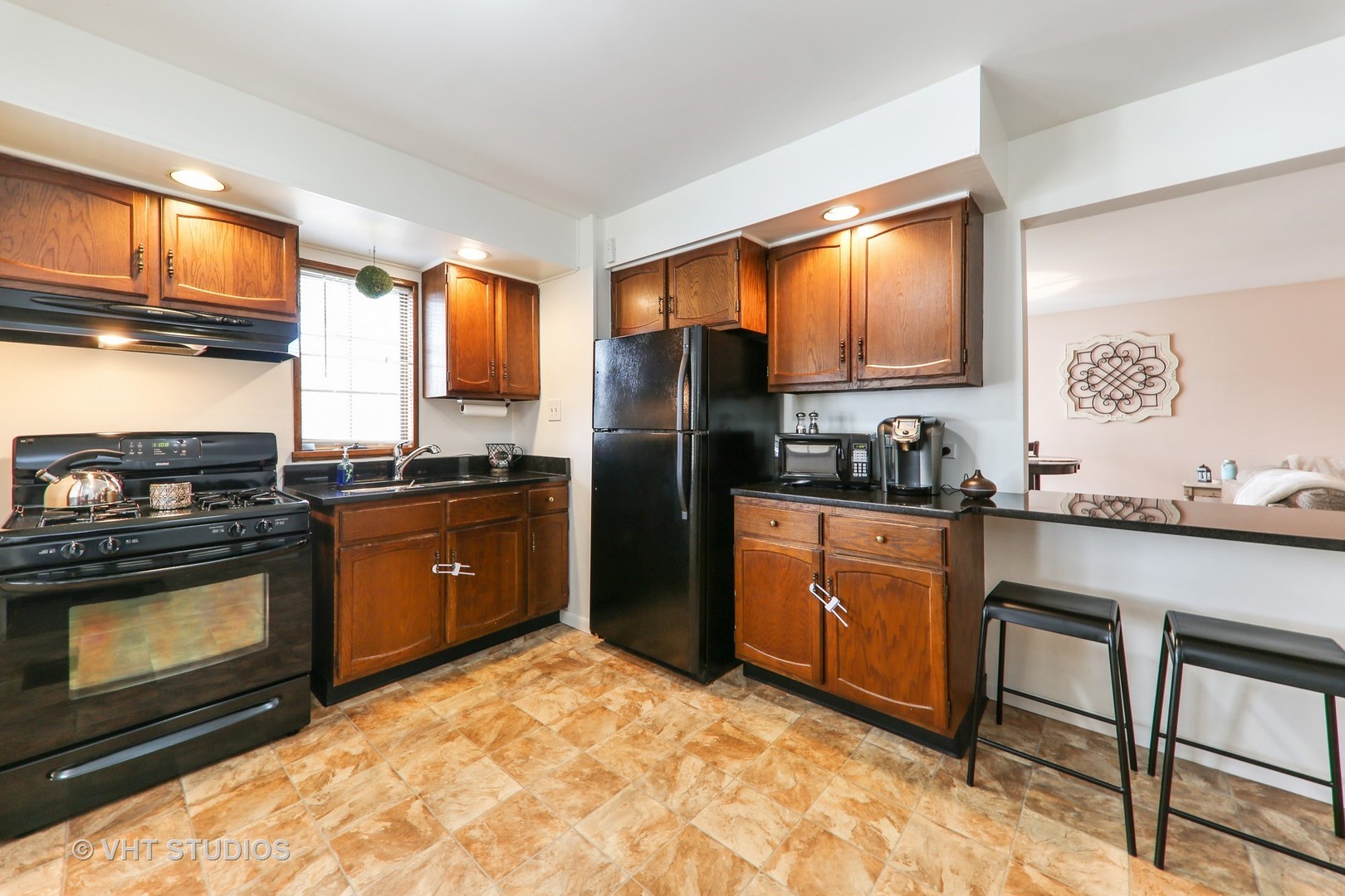 883 South York Street Elmhurst, IL 60126 - Photo 2 of 12 a kitchen with stainless steel appliances granite countertop a refrigerator stove top oven a sink and dishwasher