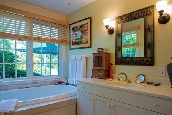 a bathroom with a sink and a window