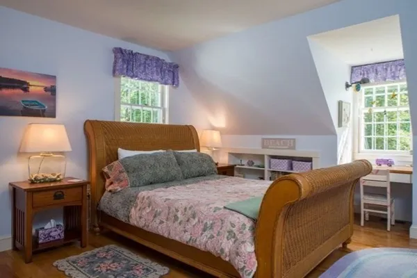 a bedroom with a bed and a couch