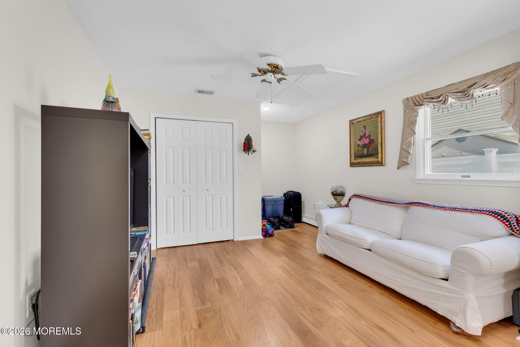101 Andover Lane Matawan, NJ 07747 - Photo 26 of 51 a living room with furniture and a flat screen tv