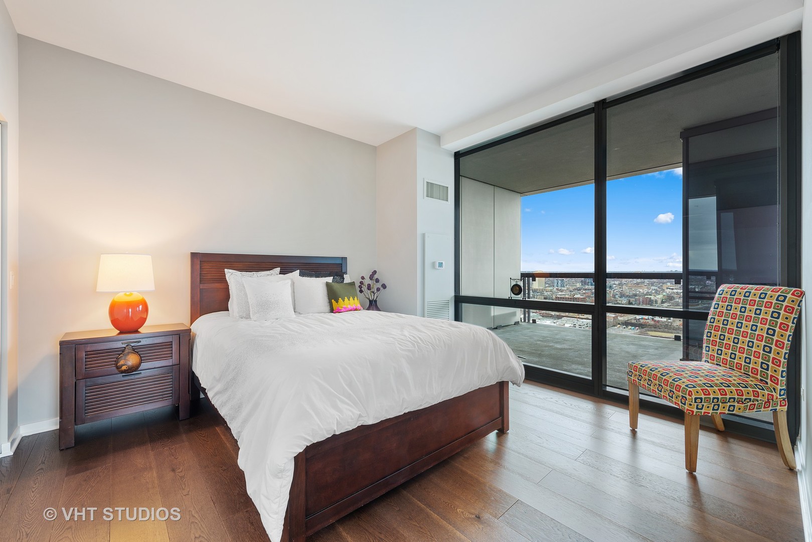 860 West Blackhawk Street, Unit 2803 Chicago, IL 60642 - Photo 13 of 17 a bedroom with a bed and a view of kitchen