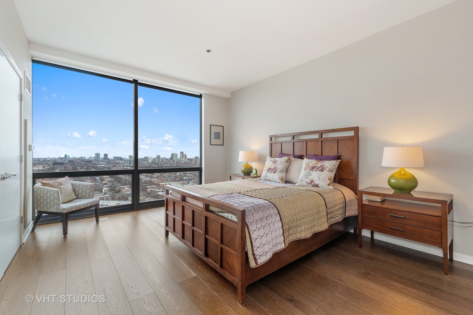 860 West Blackhawk Street, Unit 2803 Chicago, IL 60642 - Photo 10 of 17 a bedroom with a bed and a night stand
