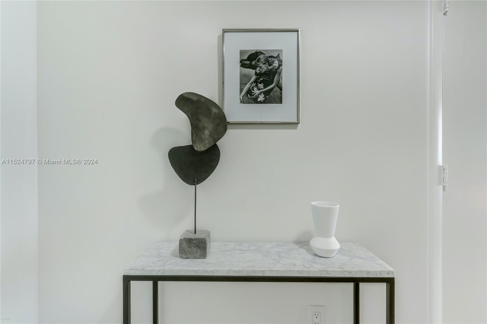 2889 McFarlane Road, Unit 2017 Coconut Grove, FL 33133 - Photo 18 of 19 a bathroom with a sink and mirror