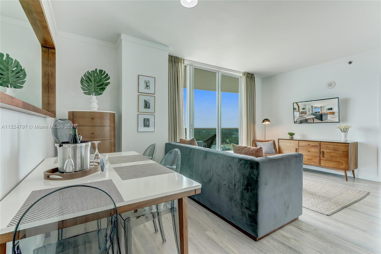 2889 McFarlane Road, Unit 2017 Coconut Grove, FL 33133 - Photo 6 of 19 a living room with furniture and window