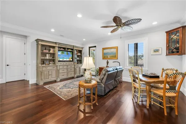 a living room with furniture or couch and a wooden floor