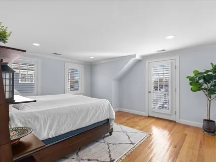 a bathroom with a glass shower door and a sink