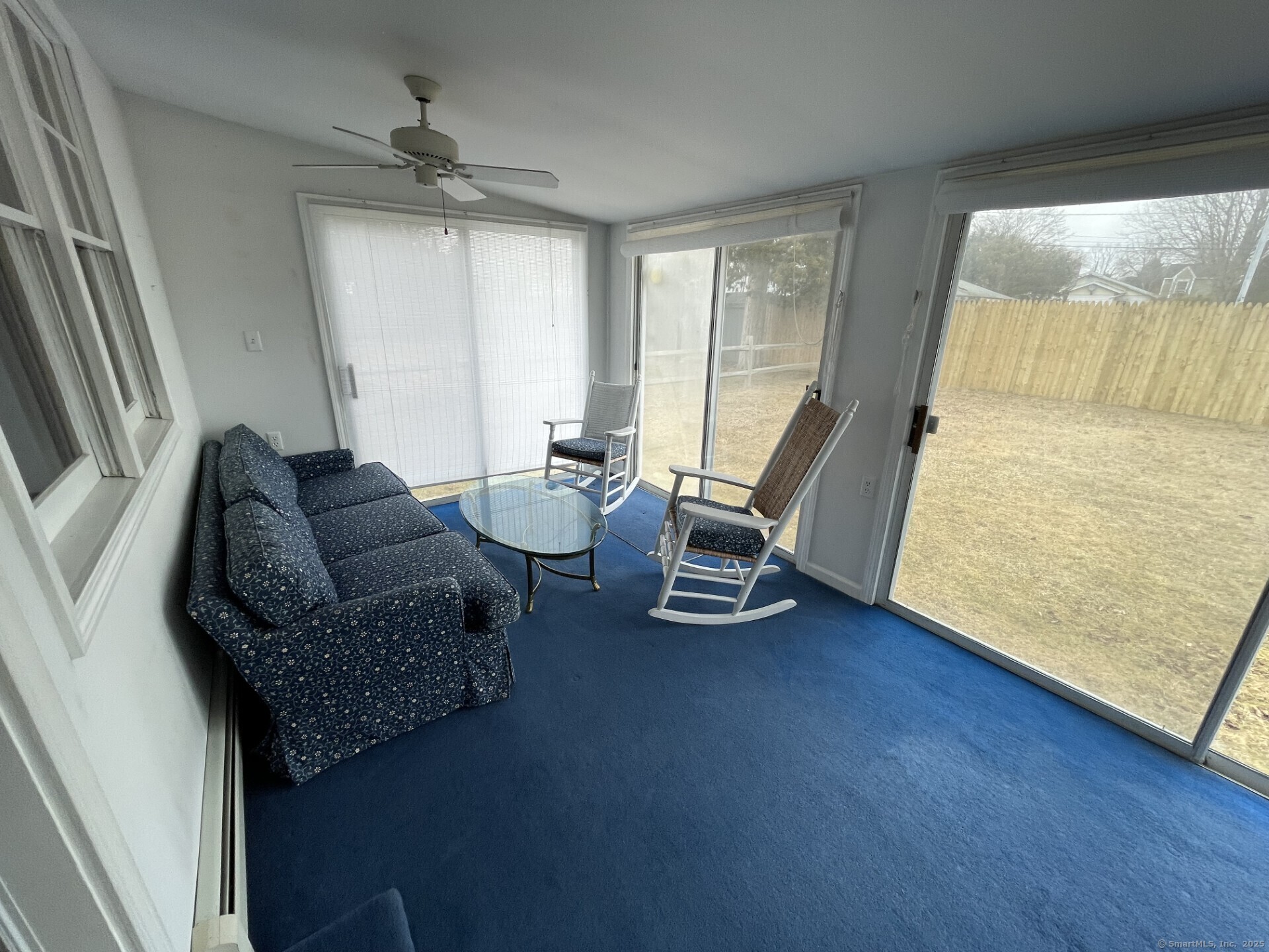 41 Harbor Avenue Madison, CT 06443 - Photo 13 of 27 a living room with furniture and a large window