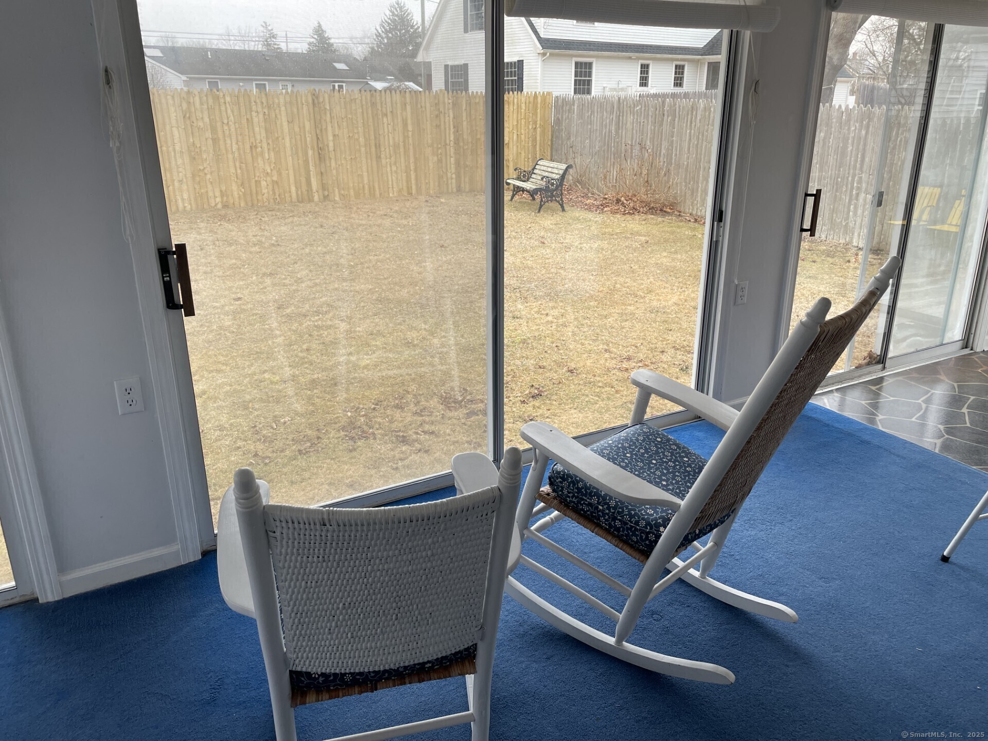 41 Harbor Avenue Madison, CT 06443 - Photo 14 of 27 a living room with a table and a potted plant
