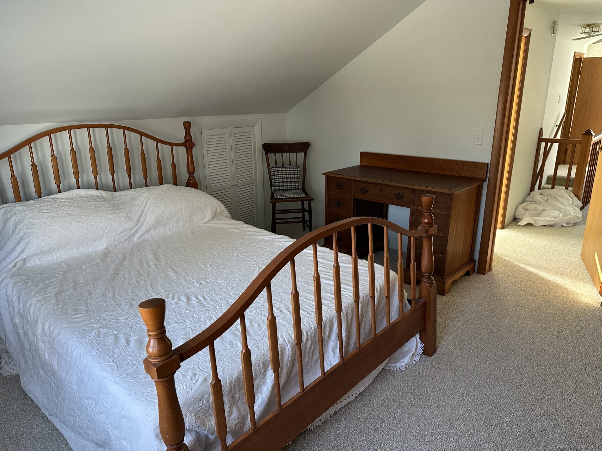 41 Harbor Avenue Madison, CT 06443 - Photo 15 of 27 a view of staircase with lots of frames on stairs