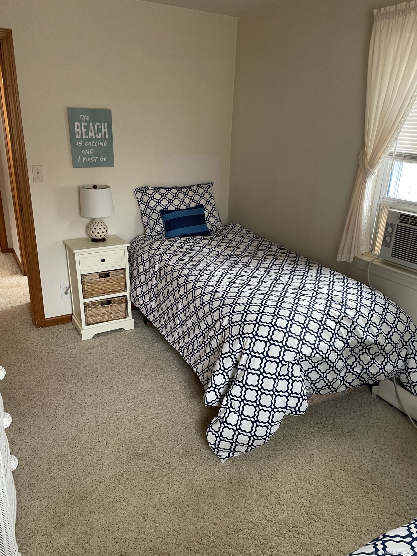 41 Harbor Avenue Madison, CT 06443 - Photo 19 of 27 a bedroom with a bed and a window