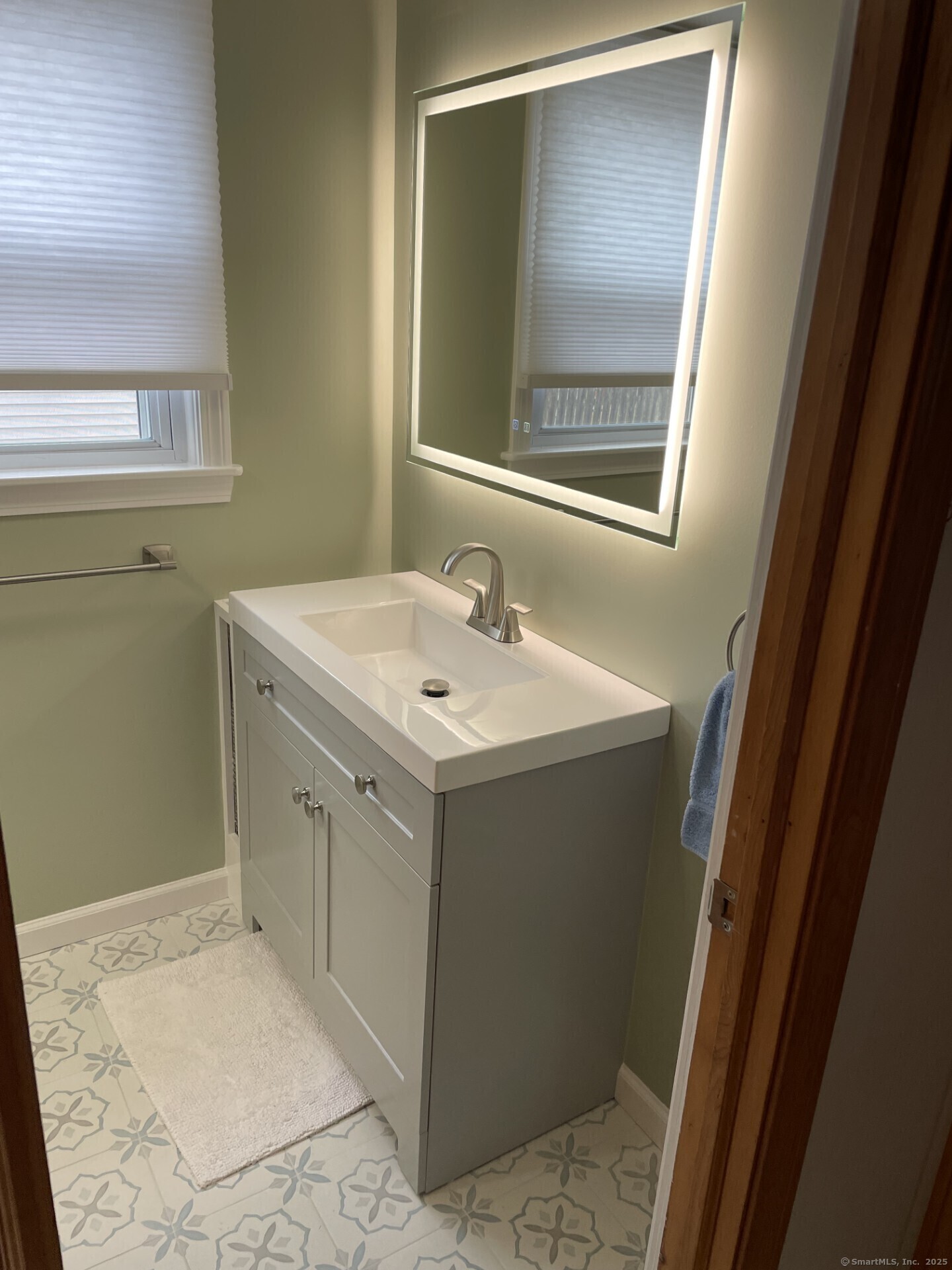 41 Harbor Avenue Madison, CT 06443 - Photo 23 of 27 a bathroom with a sink and a mirror