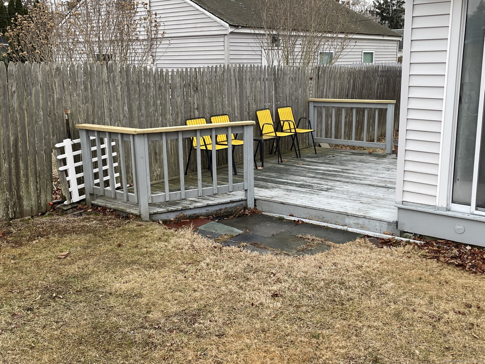 41 Harbor Avenue Madison, CT 06443 - Photo 25 of 27 a view of a wooden deck with chairs